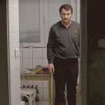 Cristi Puiu in kitchen in Aurora. Film Still courtesy of the Cinema Guild