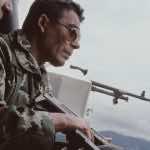 General Benedicto Lucas García in a film still from ‘Granito’ riding in helicopter before it is shot down.