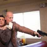 Joseph Gordon-Levitt and Bruce Willis in LOOPER. Image courtesy of TriStar Pictures, Film District and End Game Entertainment