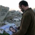 Amin-Holding-Martyr-Poster-of-Siham-1024×575